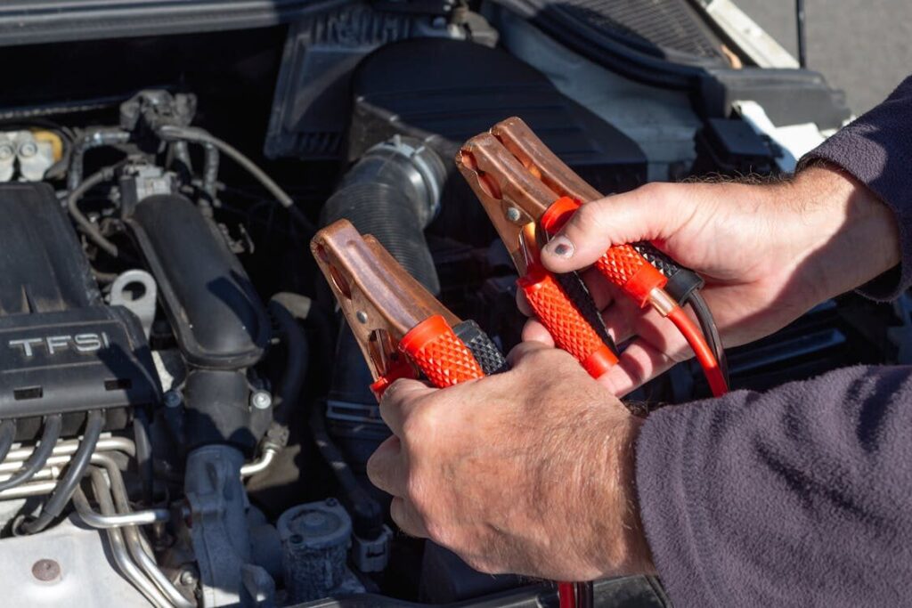 Technician testing vehicle transmission with diagnostic tools at AA Transmission.