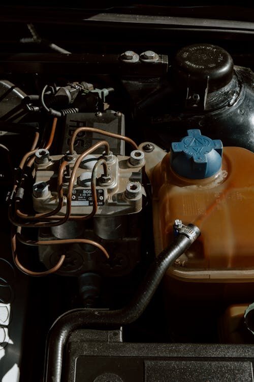 Close-up of transmission system components in a vehicle engine bay, showcasing mechanical parts and.