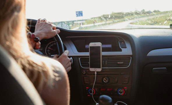 Auto repair dashboard with smartphone holder and navigation system.
