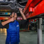 Young Female Mechanic Working Repair Car Engine