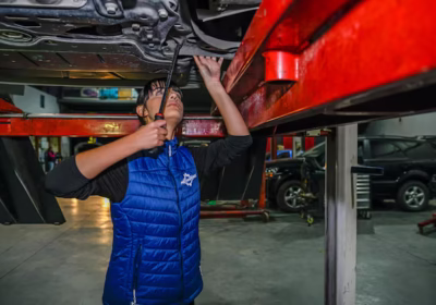 Young Female Mechanic Working Repair Car Engine