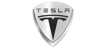 Tesla logo on a vehicle at Advanced Auto Clinic for expert electric vehicle repairs.