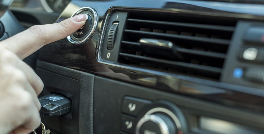 Car AC control panel in a vehicle dashboard.
