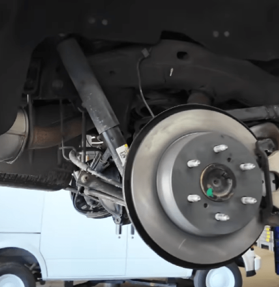 Vehicle front brake system being serviced at Al’s Automotive.