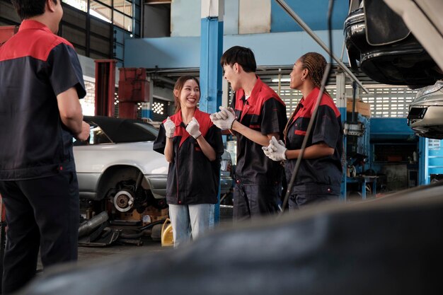 Fleet maintenance team discussing repairs at auto repair shop.