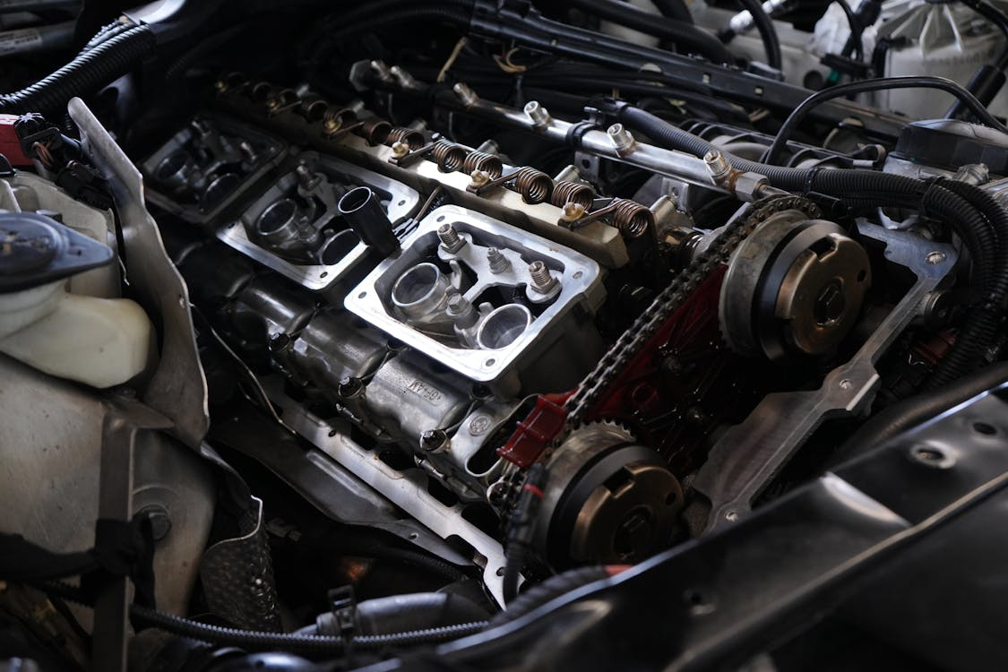 Close-up of a car engine undergoing repair at Arrow Automotive.