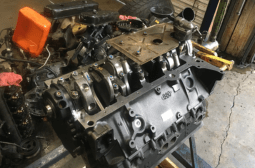 Disassembled car engine for repair at ASAP Automotive Service & Performance.