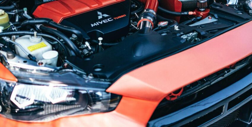 Engine bay of a performance vehicle with upgraded components.