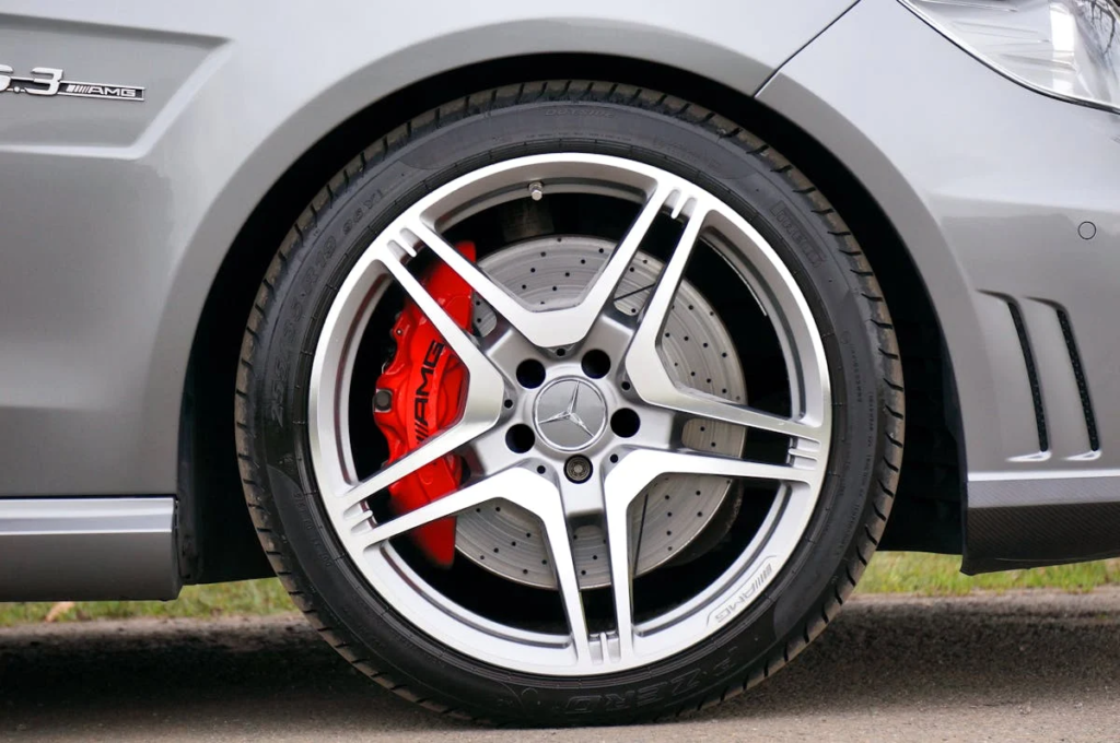 High-performance brake disc and red AMG brake caliper for enhanced stopping power.