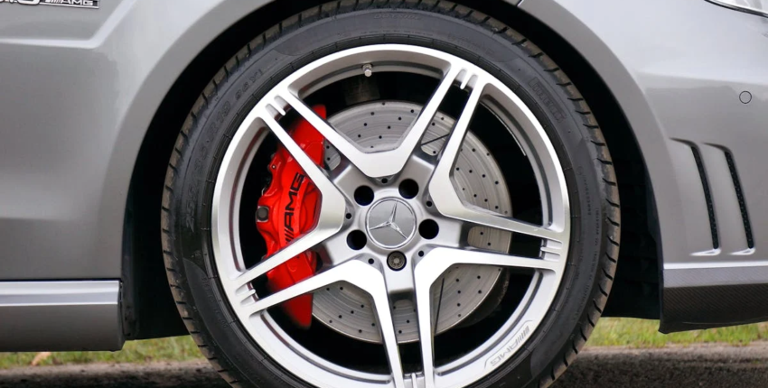 High-performance brake disc and red AMG brake caliper for enhanced stopping power.