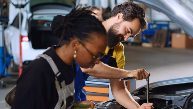 close-up-shot-coworking-mechanics-car-service-using-torque-wrench-fix-damaged-automobile-man-african-american-woman-repair-shop-servicing-broken-vehicle-using-professional-tools_482257-74128.avif
