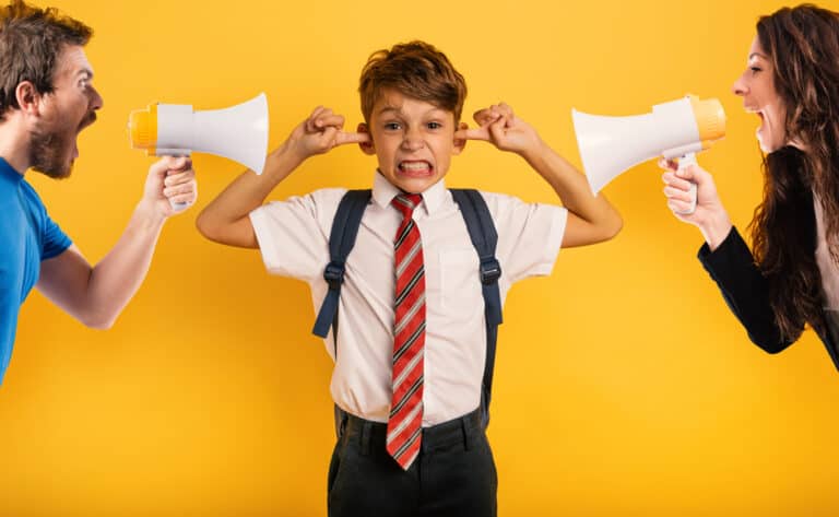 Student Child covers his ears because he does not want to hear reproach of the parents