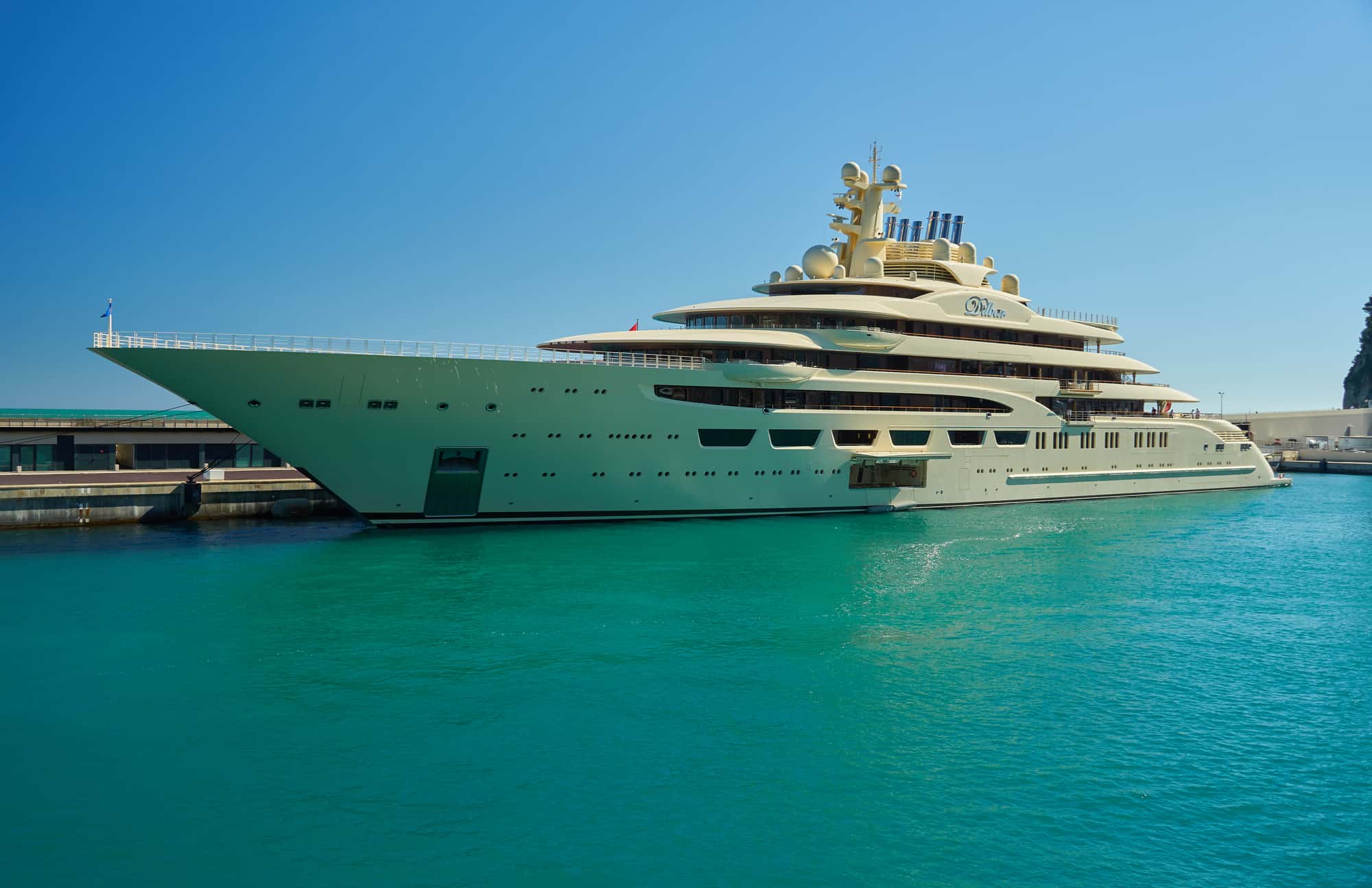 Monaco - April 05, 2019: View of one of the largest yachts in the world Dilbar near Yacht club of Monaco.