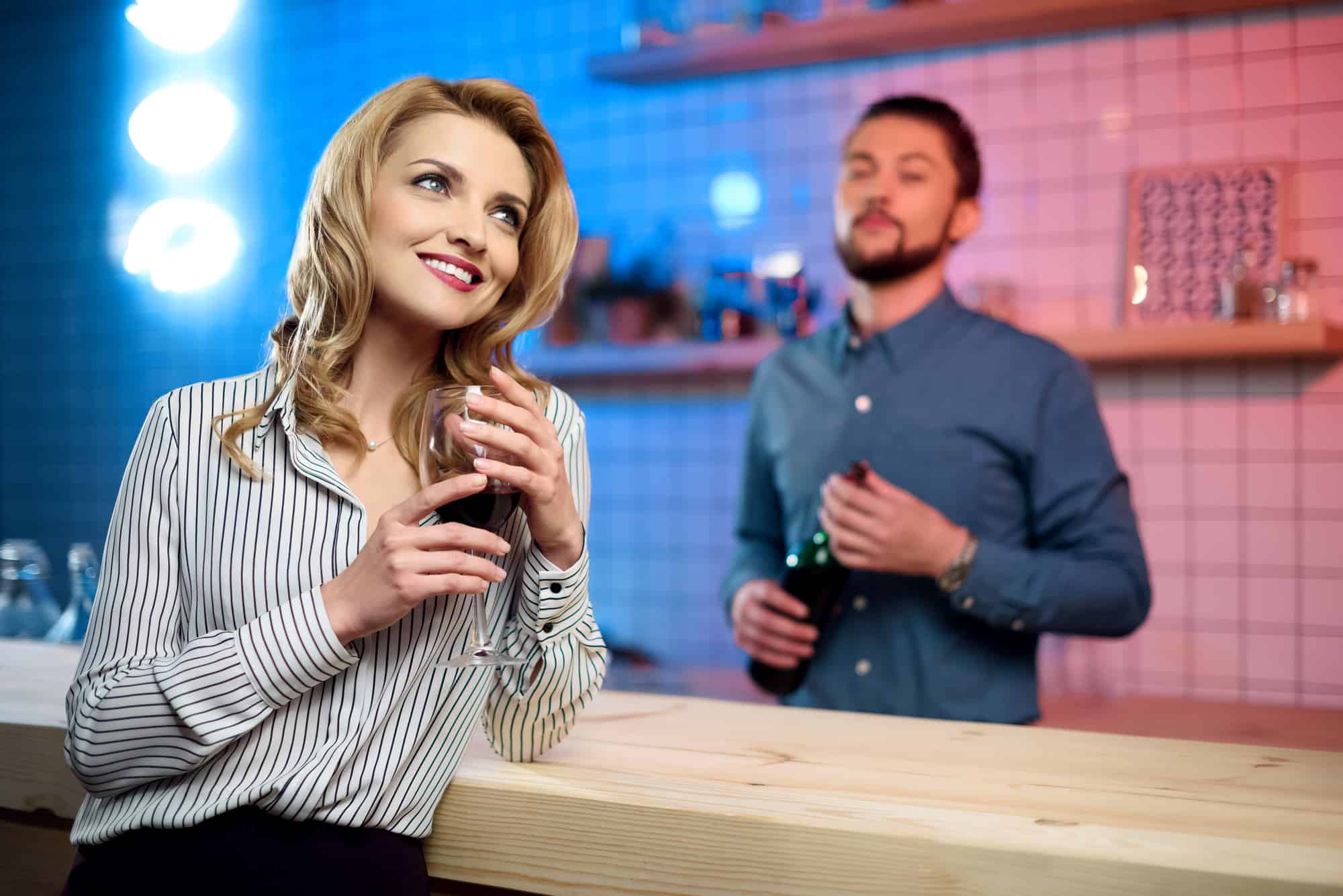 Woman flirting with bartender