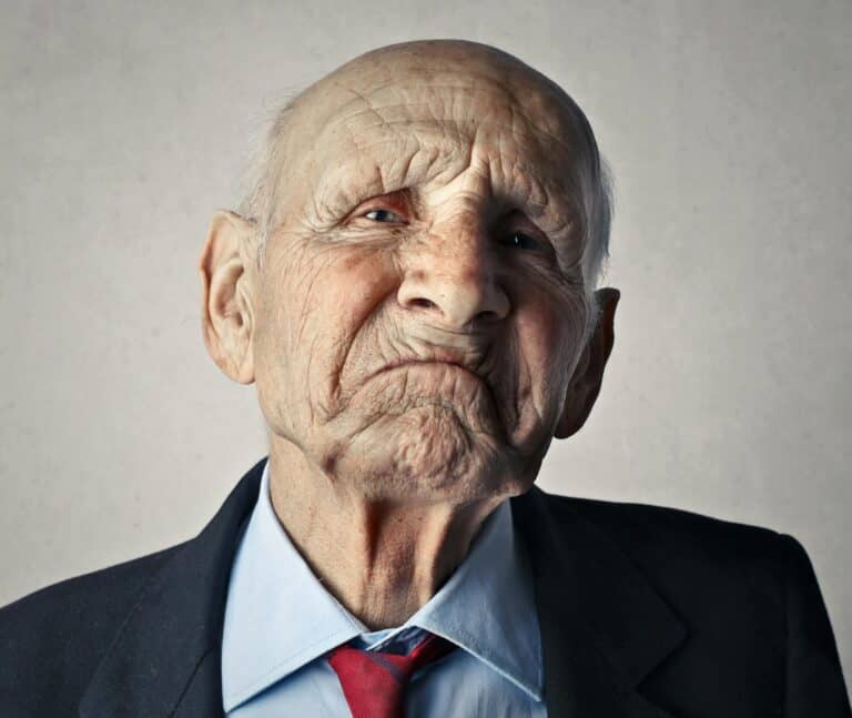Senior Man in Black Formal Coat