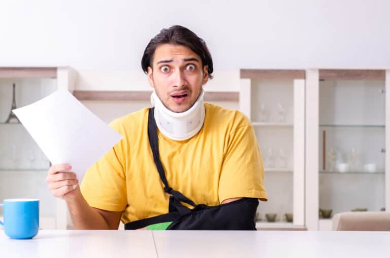 The young man after car accident suffering at home