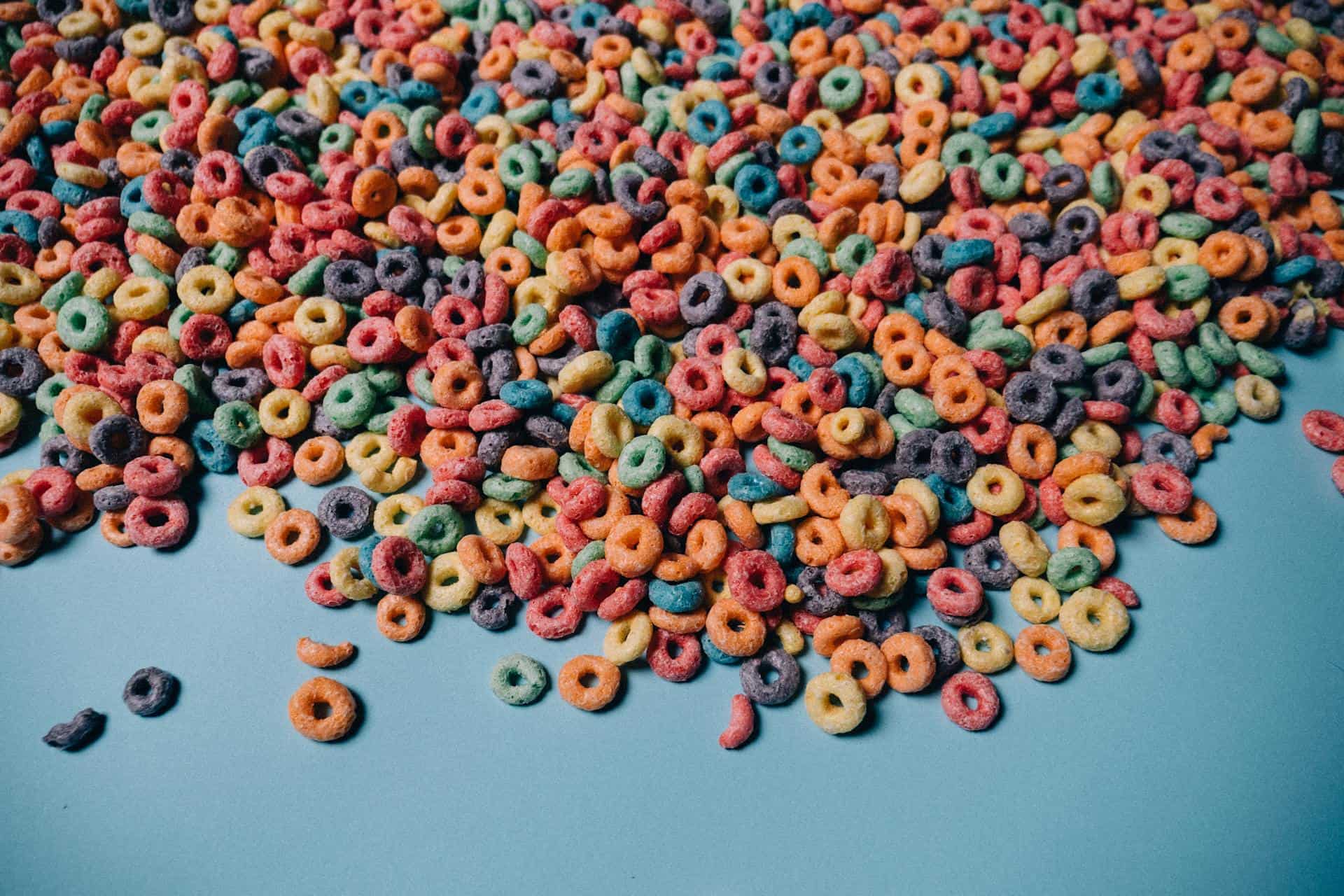 Multicoloured Cereals against Blue Background