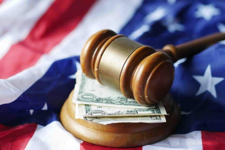 A Mallet on Top of Bills on top of the American flag