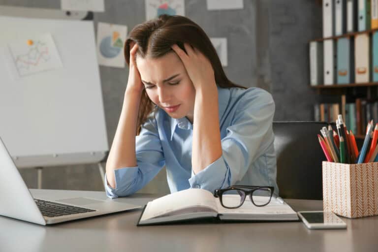 Young woman suffering from headache