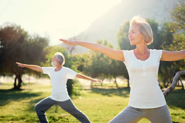 Senior family exercising outdoors