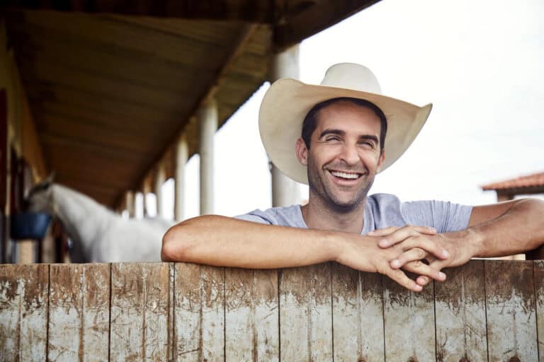 Happy cowboy guy smiling, portrait