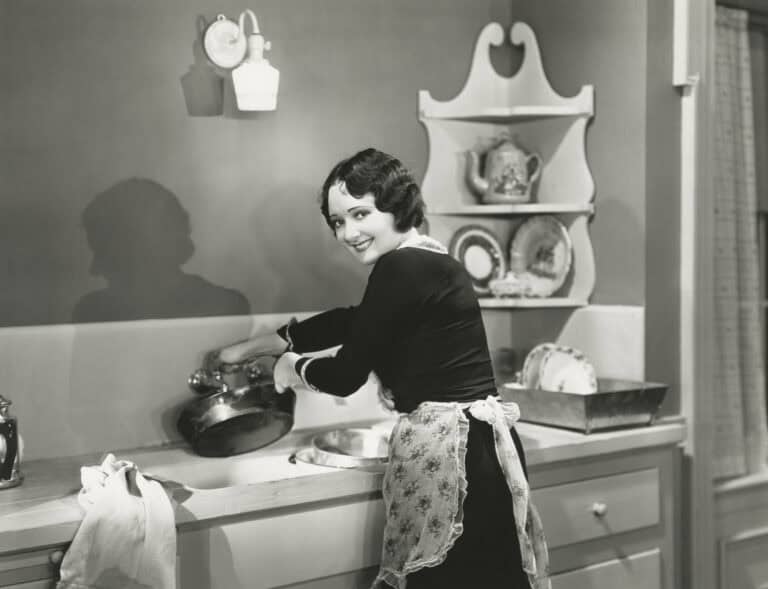 Happily washing pots and pans (OLVI008_OU383_F)