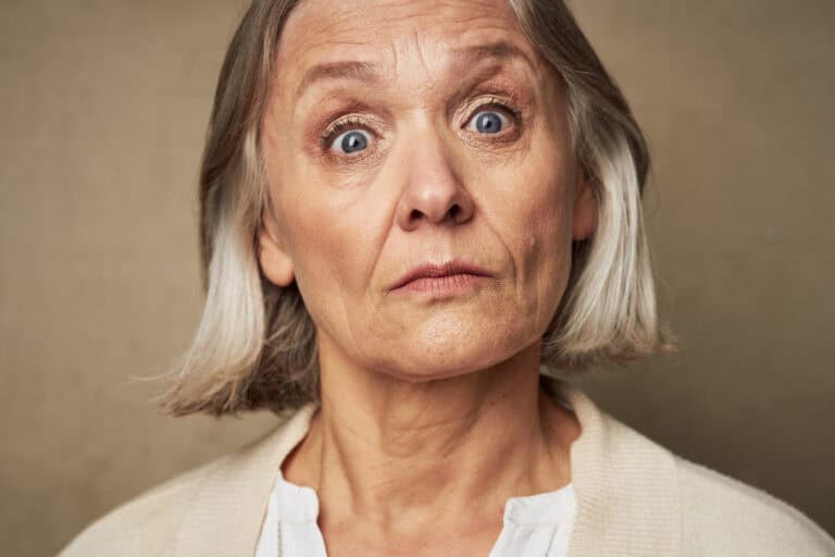 elderly woman in robe face closeup posing isolated background. High quality photo