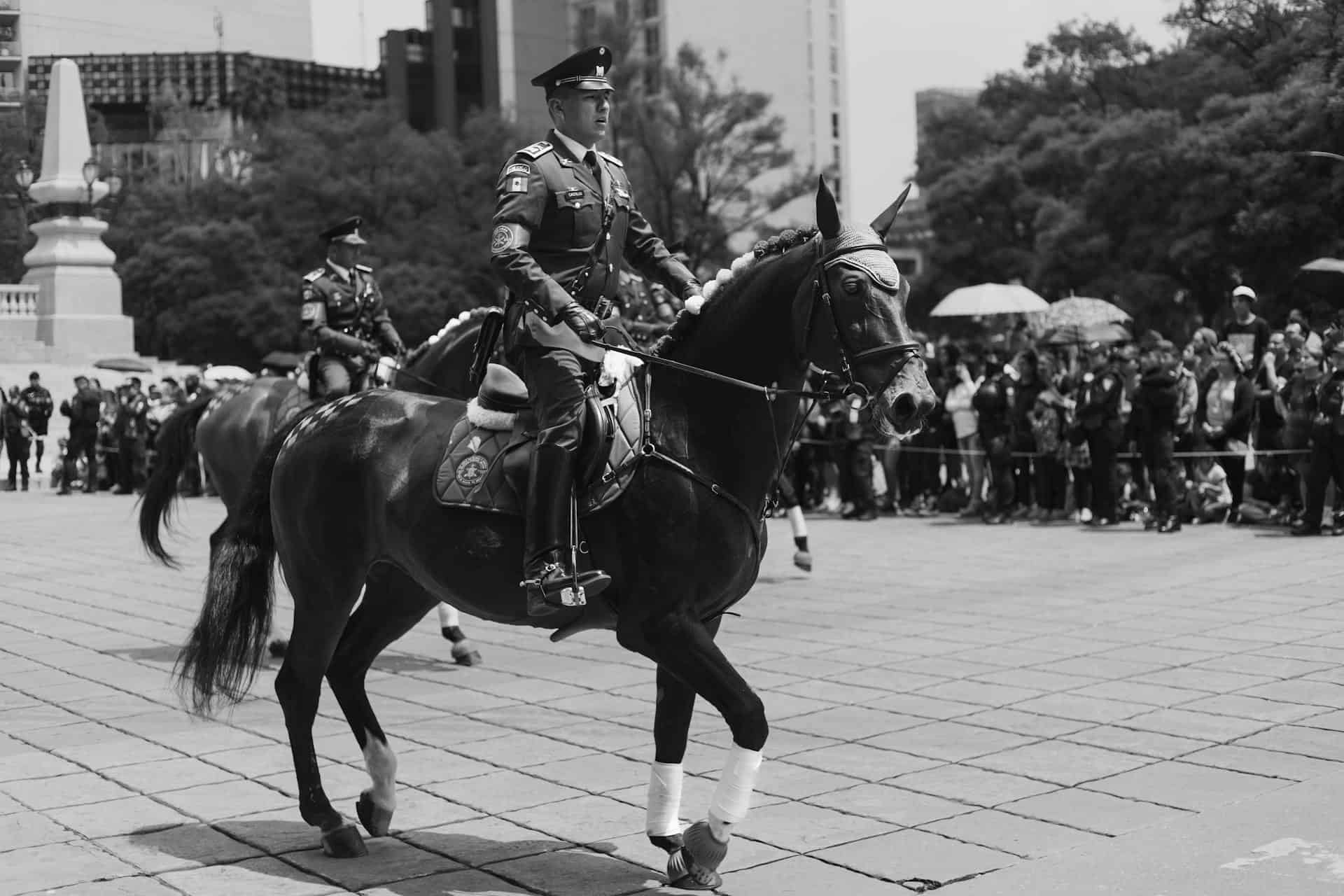 Man in Uniform on Horse in Town Square