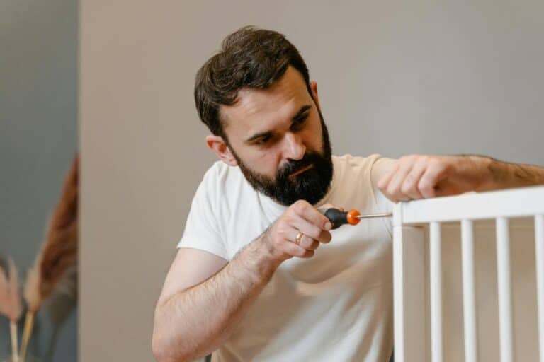Man Holding Screw Driver
