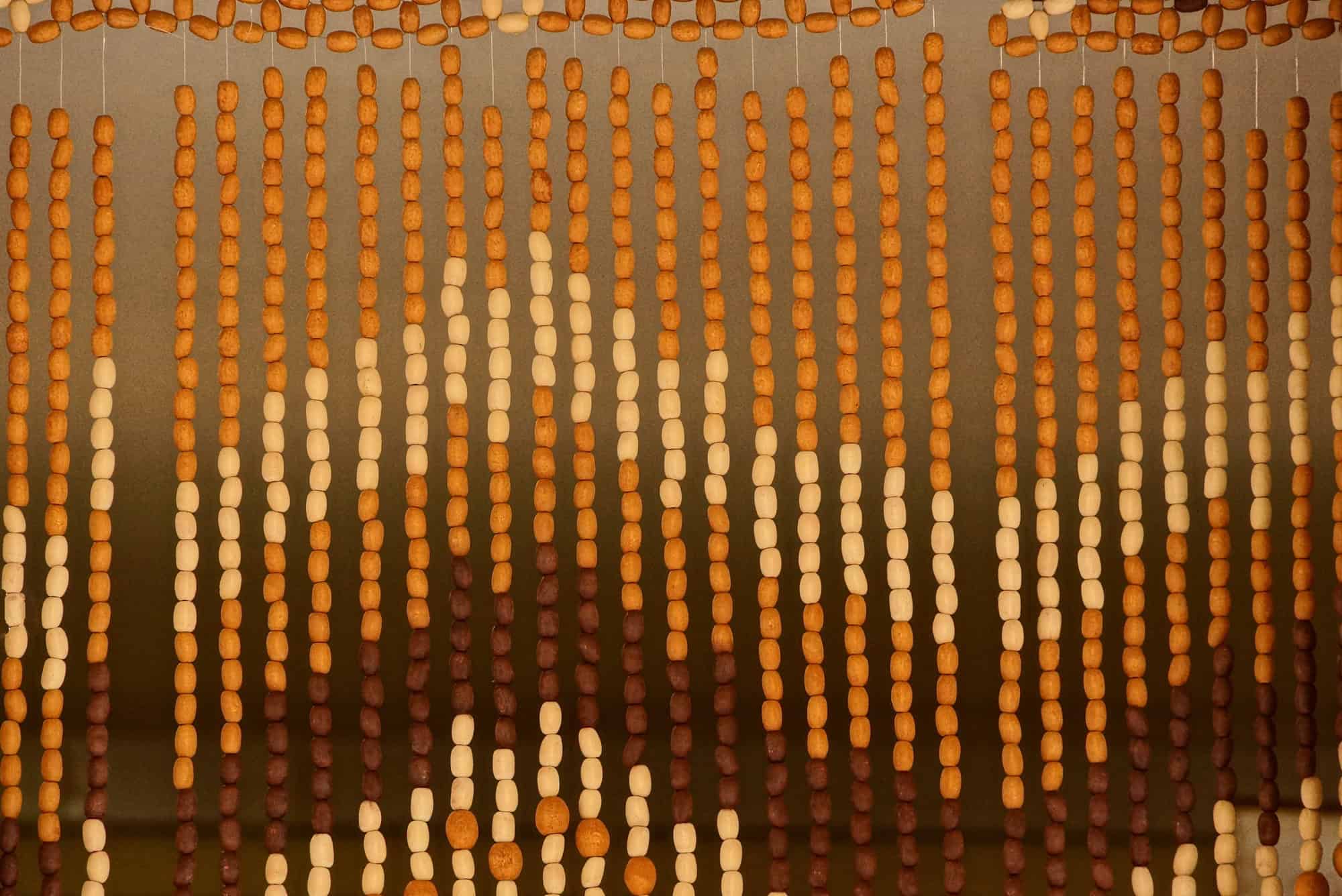 Brown striped wooden texture from a curtain of small beads