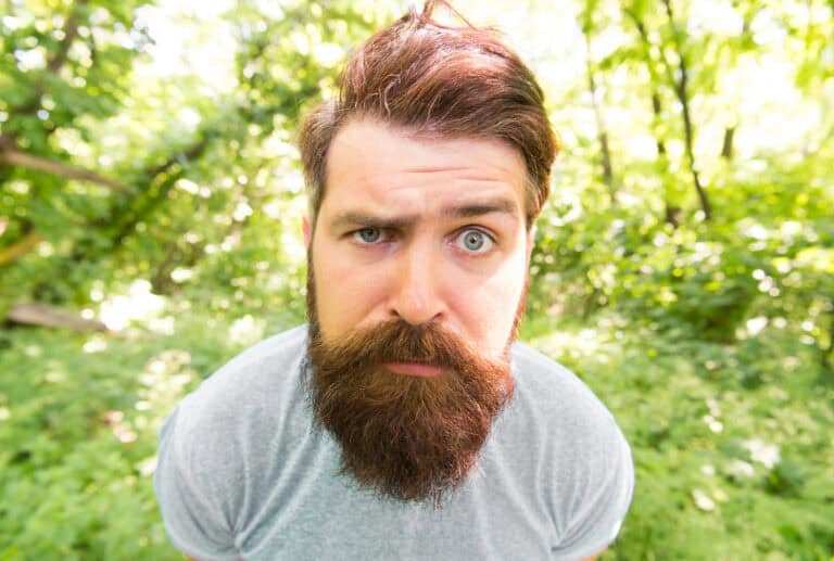 Bearded man closeup. portrait of confused bearded man.