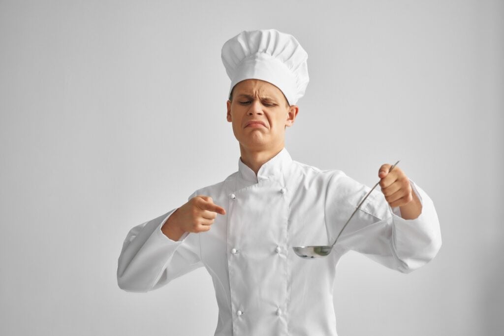 the cook looks at the cook with disgust