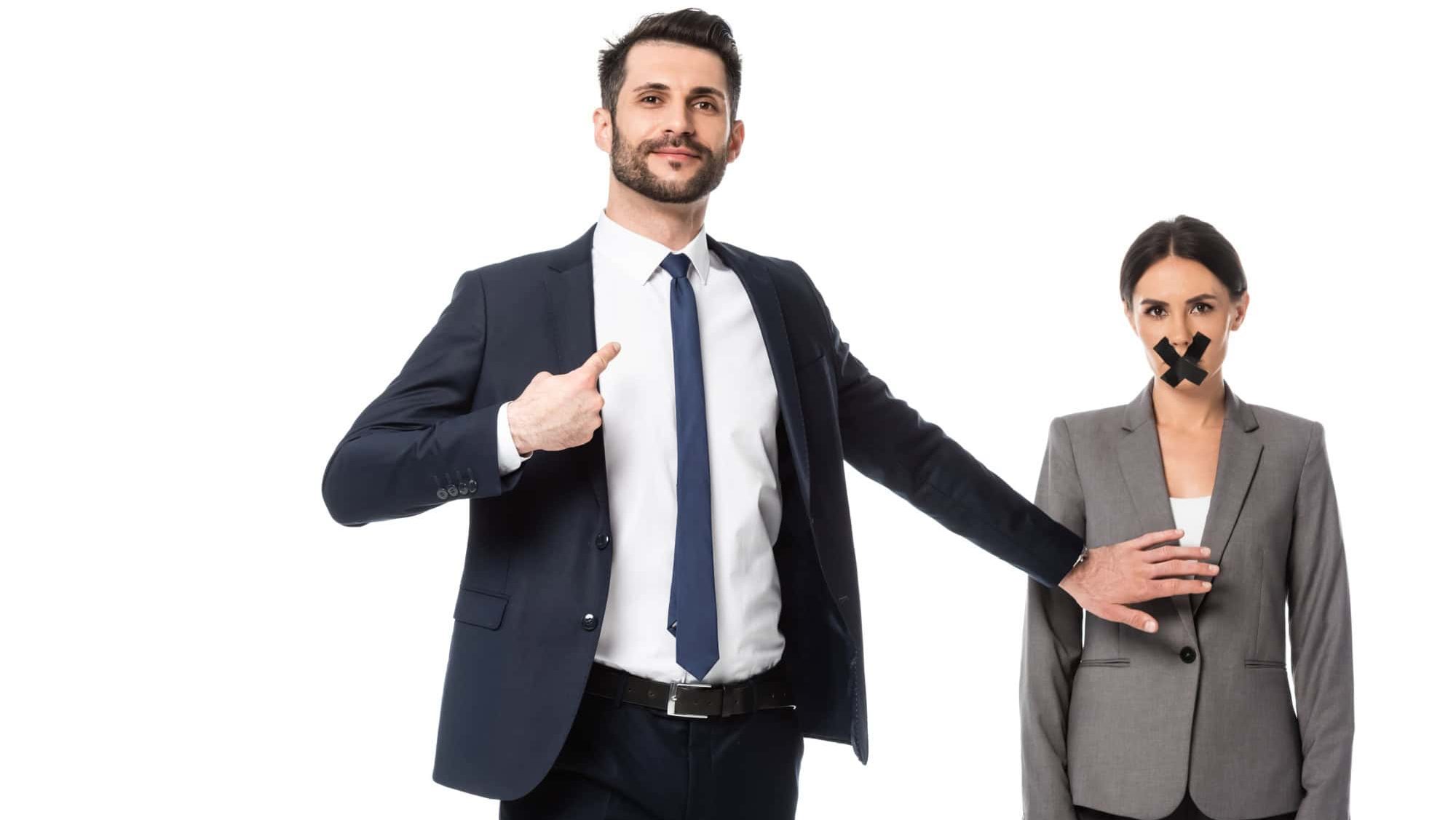 Arrogant businessman pointing with finger at himself and touching woman with scotch tape on mouth