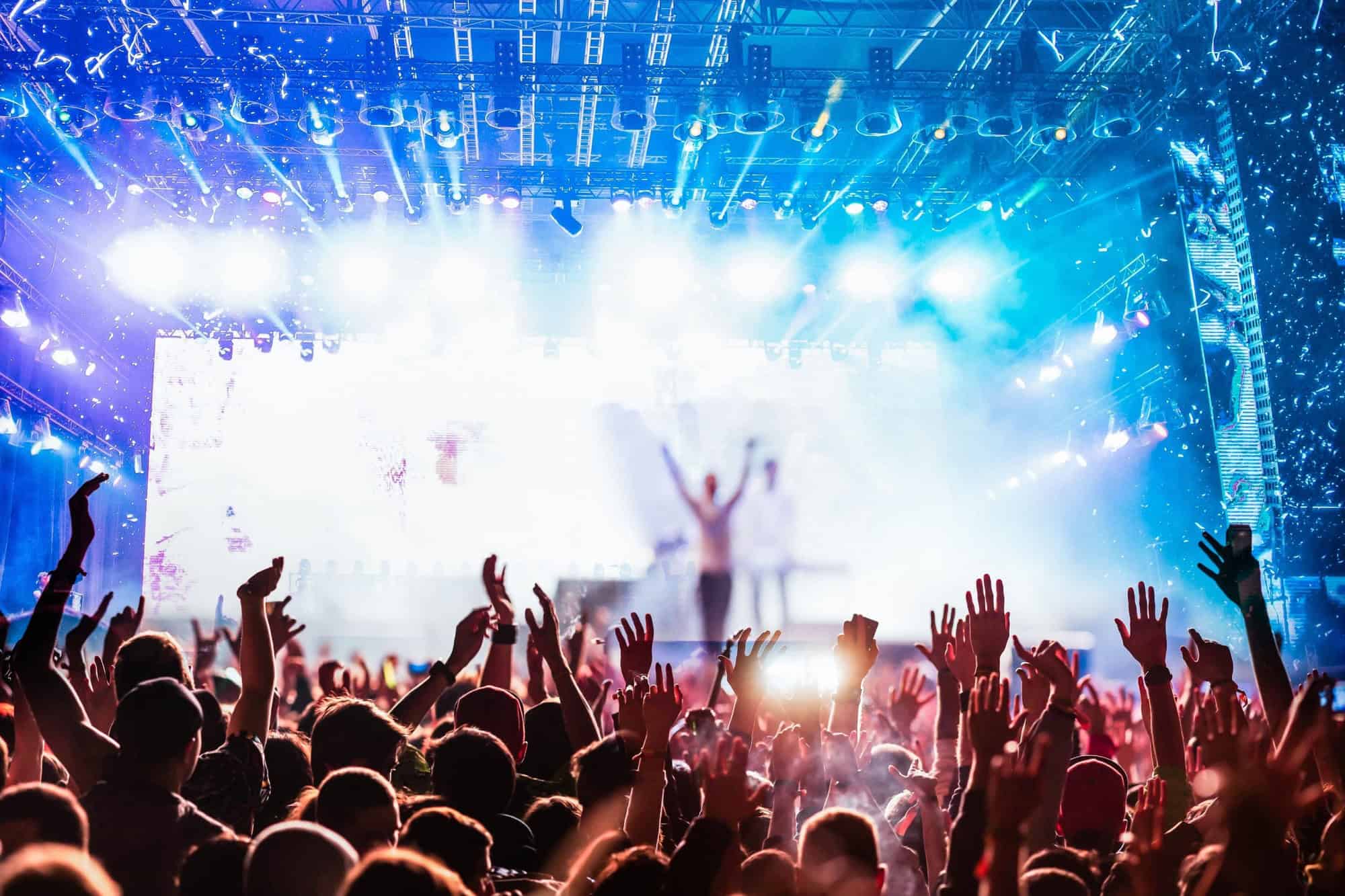 crowd partying stage lights live concert summer music festival