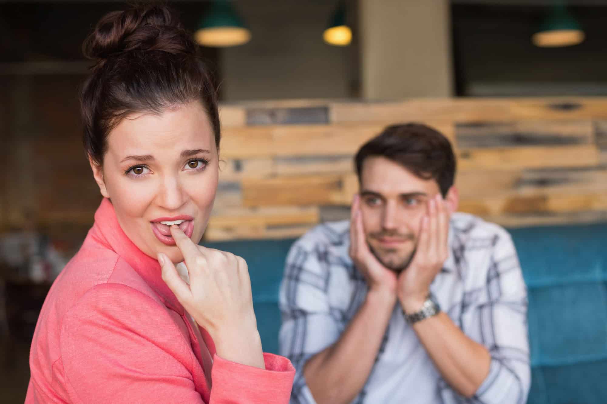 Young couple on bad date at a cafe