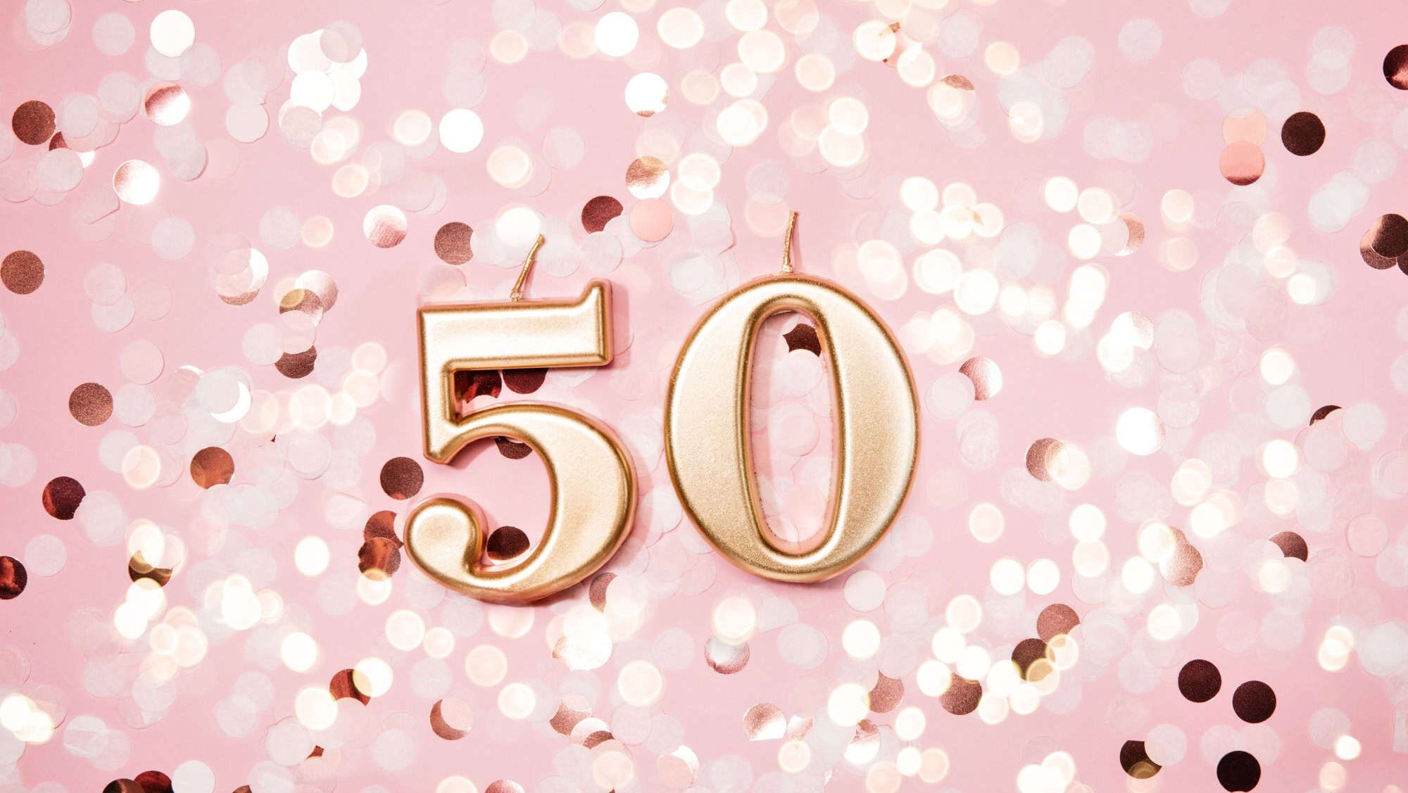 Number 50 fifty golden celebration birthday candle on Festive Background. Ten years birthday. concept of celebrating birthday, anniversary, important date, holiday