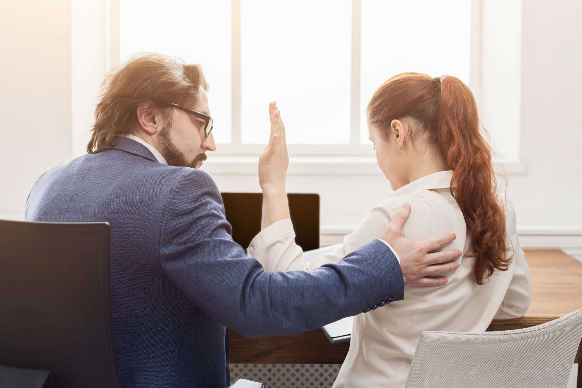 Sexual harassment at work, lustful boss touching young woman in office