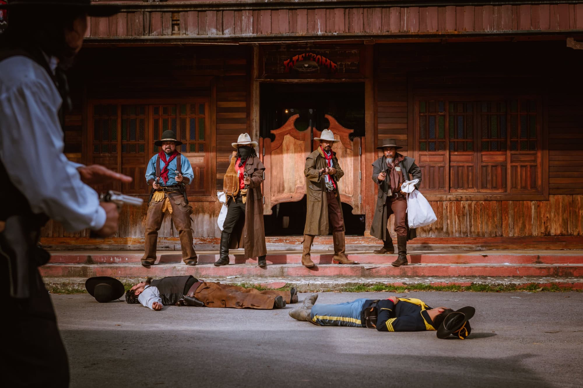 Cowboys group showing action bank rob with gun kill 2 people and a lot of money from rob the bank with fighting with another cowboys group.