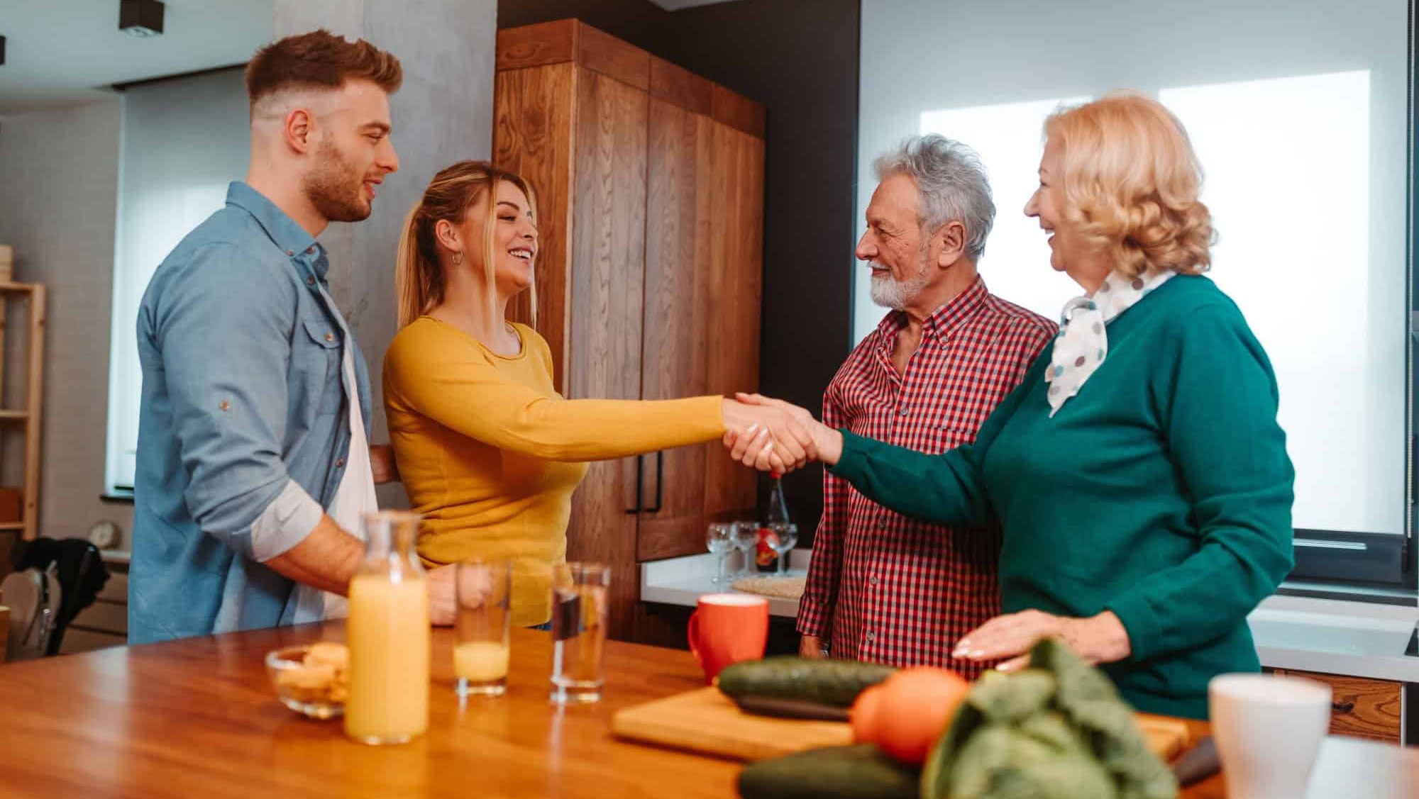 Man is introducing woman to his family.