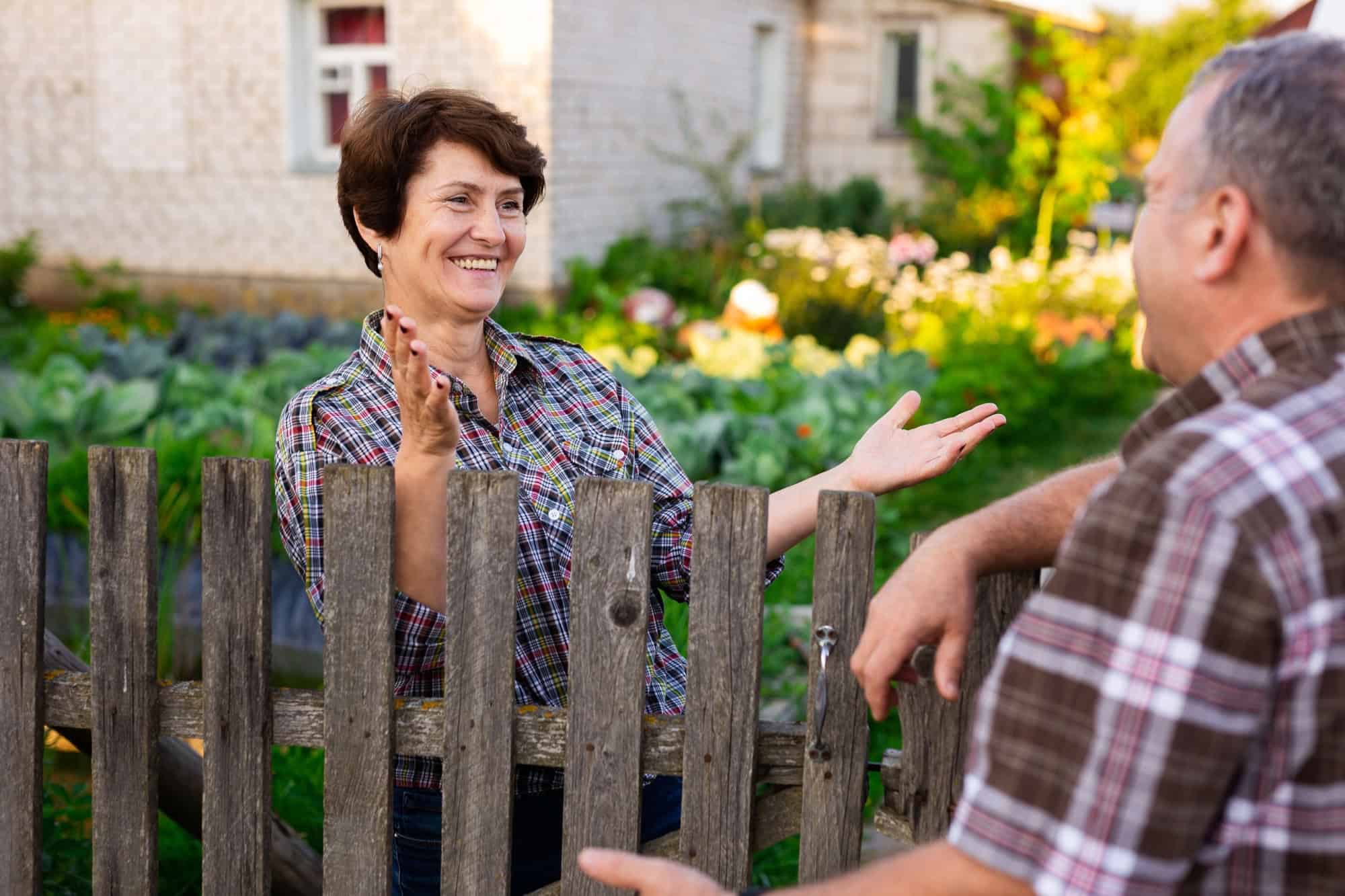 neighbors man and woman chatting near the