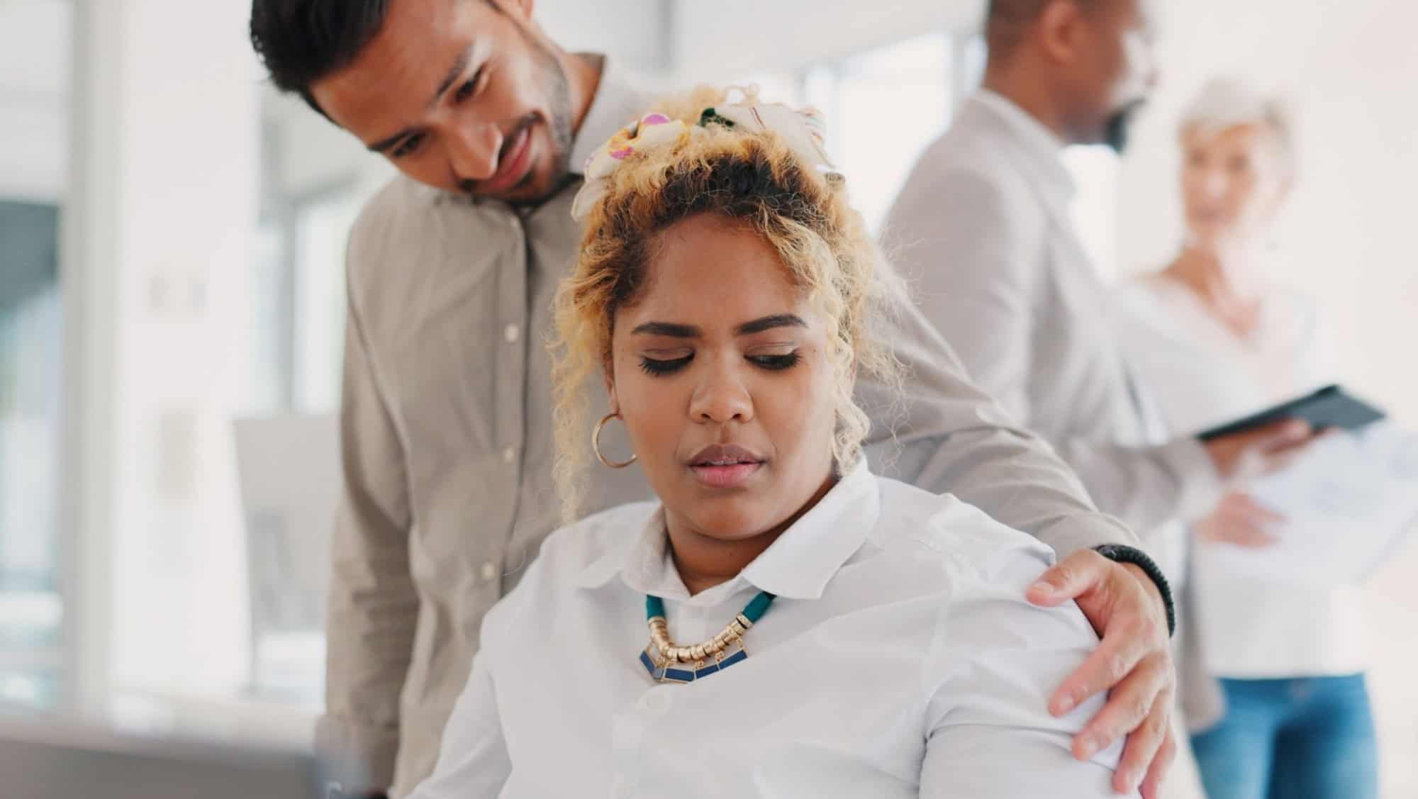 Sexual harassment, touch and uncomfortable with a business man putting a hand on the shoulder of a woman colleague. Exploitation, unprofessional and victimization with an employee touching a coworker