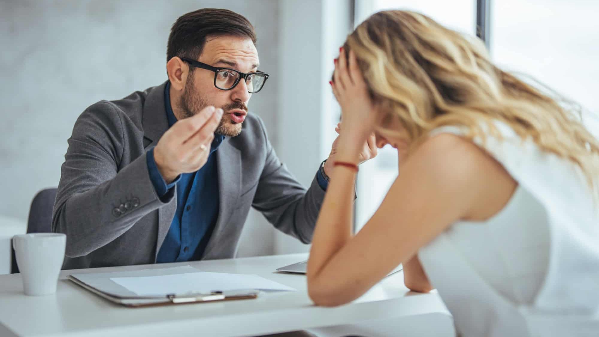 Boss threatening with finger his employee in office. Angry mean boss yelling at employee for missing deadline, executive manager scolding ineffective salesman showing bad work results