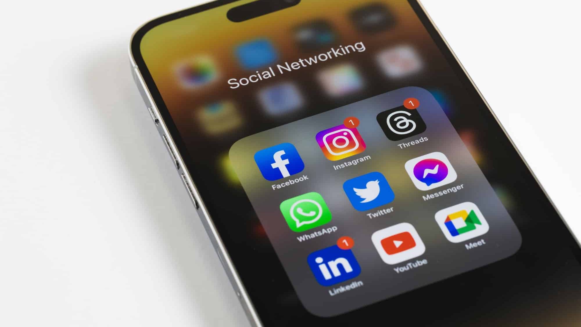 Dubai, United Arab Emirates - July 10 2023: Apple iPhone 14 with icons of social media notification: Facebook, Instagram, Threads, Whatsapp, Youtube, Twitter, LinkedIn applications or apps on screen.