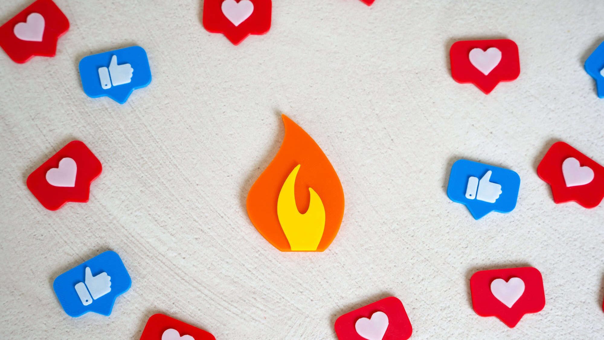 Flame figurine trending among social media likes. Viral event, memes and news. Digital trends, or online controversy. Content going viral, attention economy, or the firestorm of public opinion.