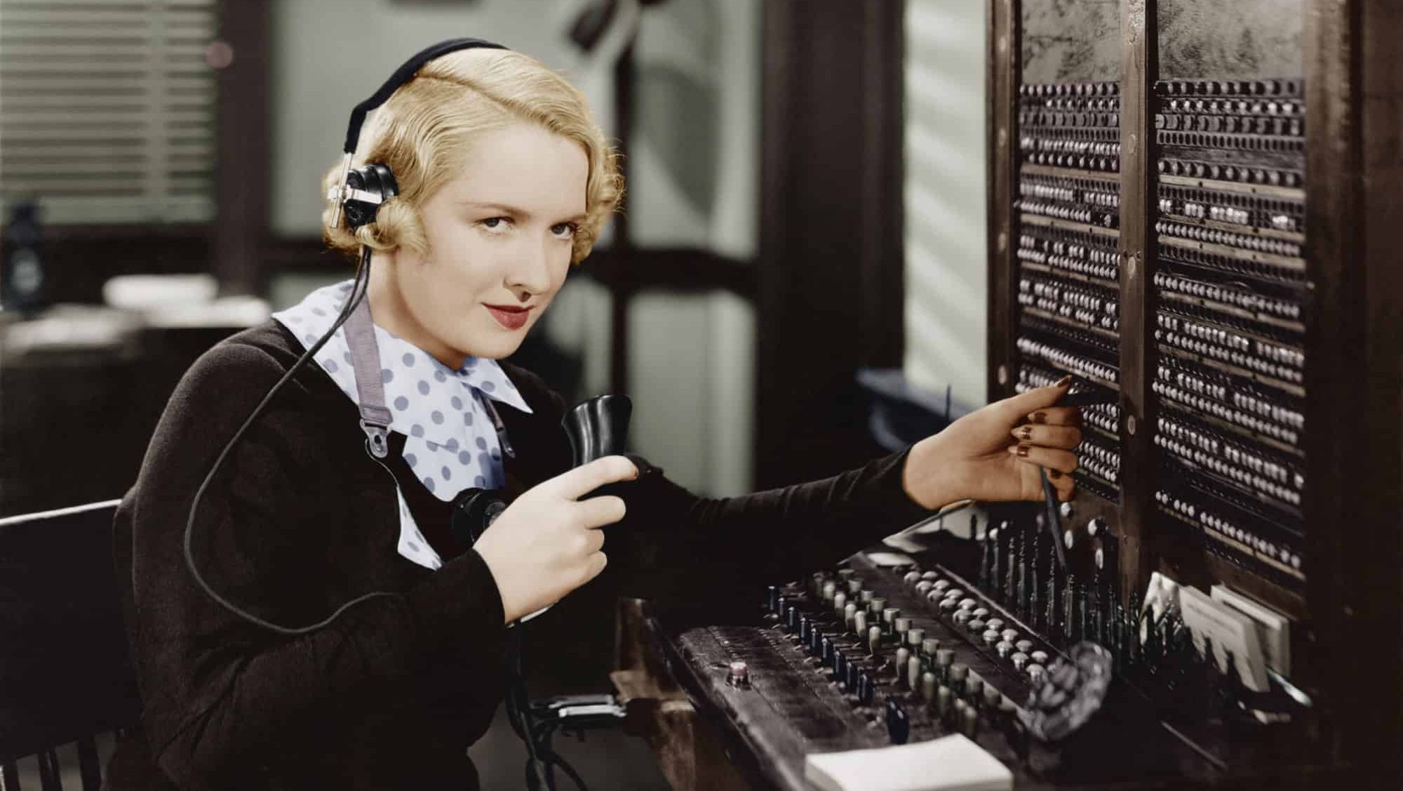 Woman operating switchboard, vintage phone, retro