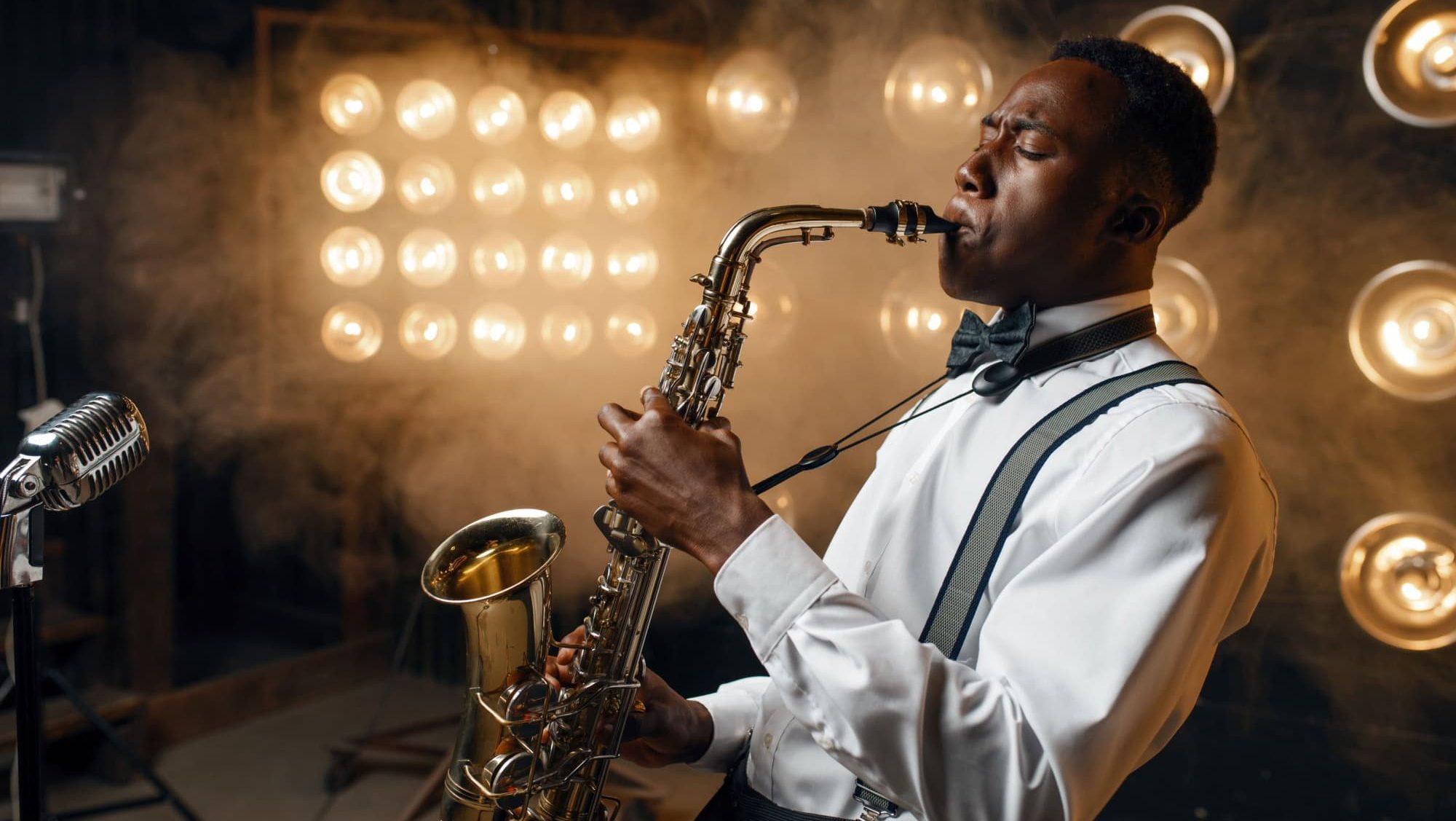 Black jazz performer plays the saxophone on stage