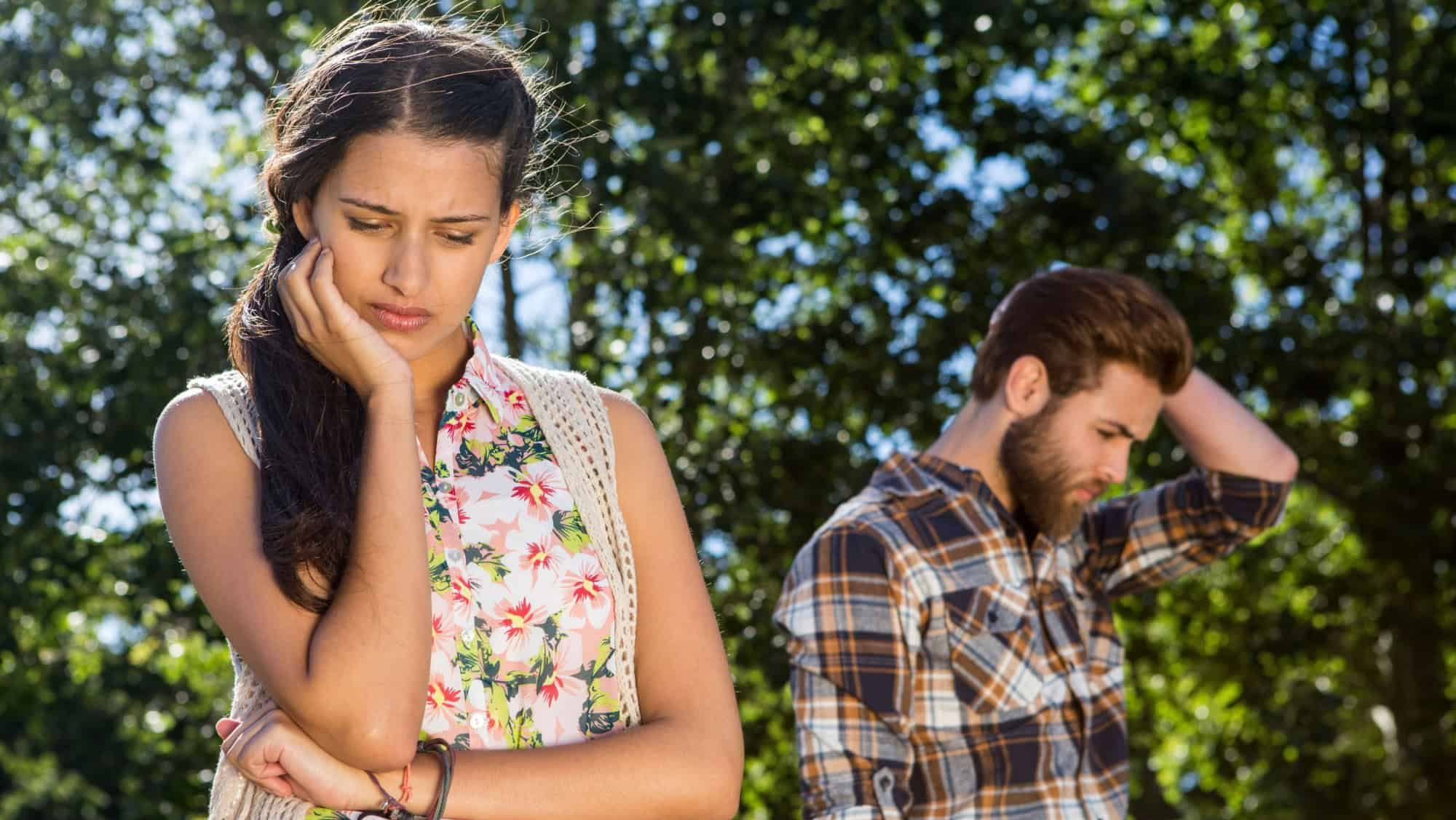 Young couple after an argument on a summers day
