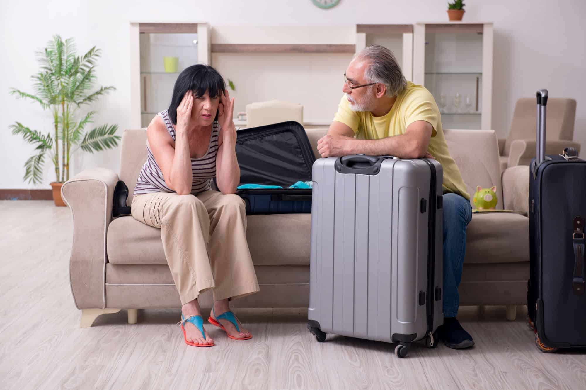 Old couple preparing for vacation travel