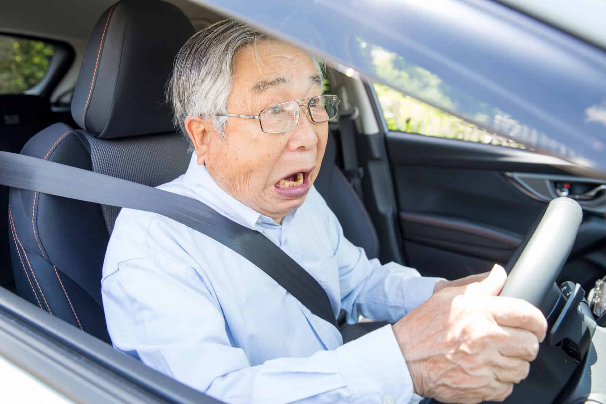 Japanese elderly man driver surprised by an accident