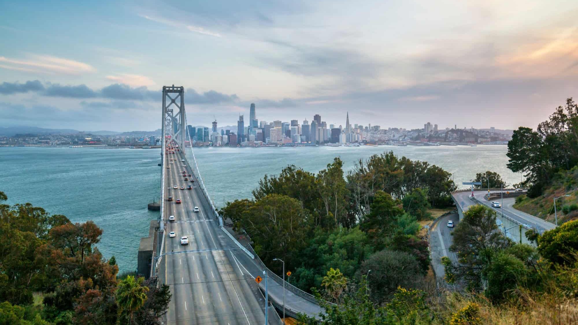 View of San Francisco skyline and Oakland Bay Bridge from Treasure Island at sunset, San Francisco, California, United States of America, North America